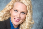 Headshot of blonde haired female executive in the education industry.