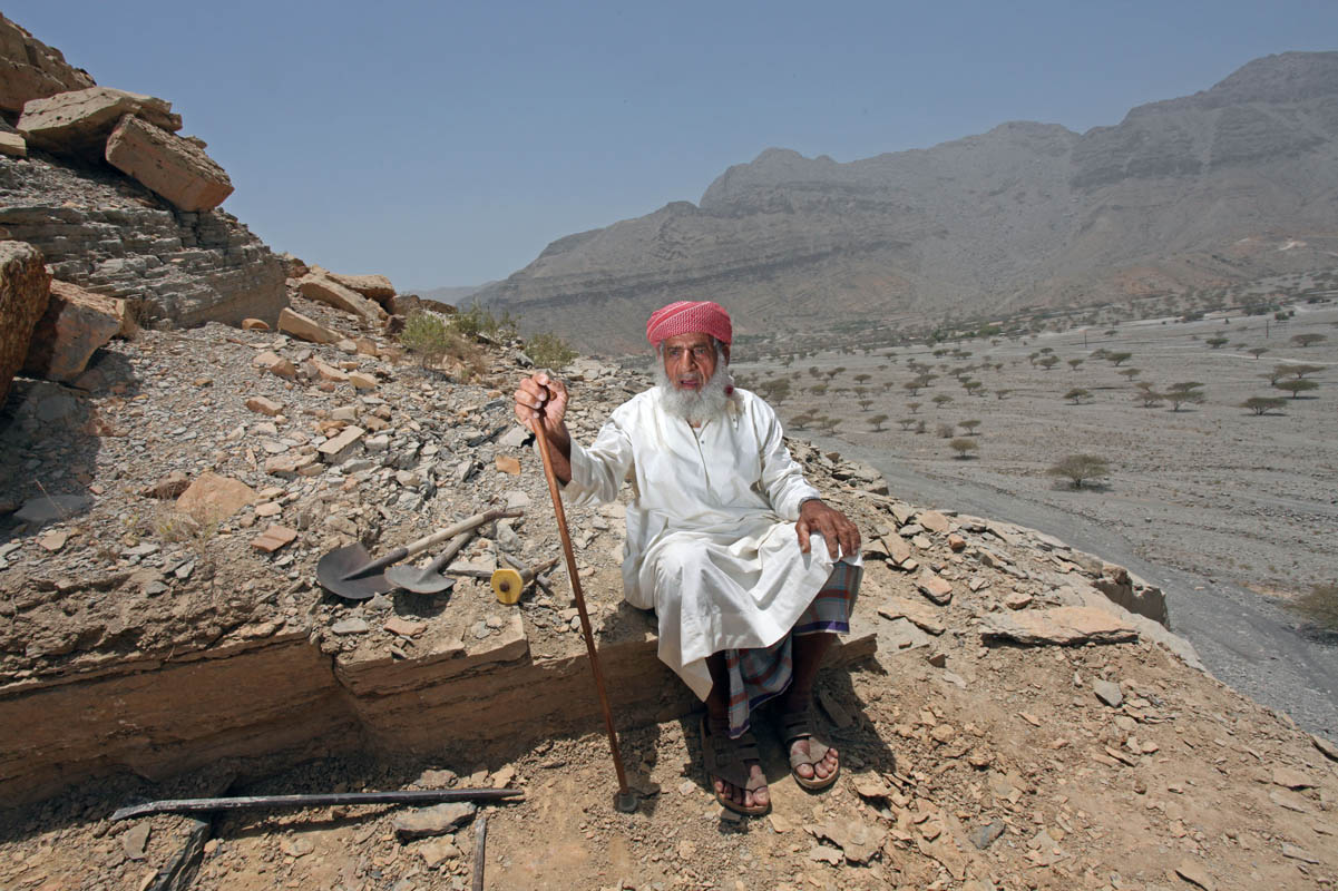 82-year-old Ali Rashid Al Dhuhoori, at his place of work in the village of Wadi Shaam located outside of Ras Al Khaimah, on May 30, 2010. Ali is the village headstone maker and each day he climbs his mountain to access the rock which he then cuts for the tombs.