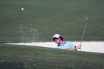 Rory McIlroy from Northern Ireland takes a shot from the bunker on the first day of the Dubai World Championship golf tournament held on the Earth Course at the Jumeirah Golf Estates in Dubai on November 19, 2009.
