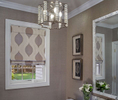 Belle Terre powder room renovation with glass bead wallcovering and custom roman shade 