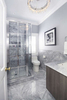 marble bathroom with coastal shower door shower enclosure