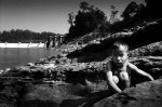 A boy in front of the Theun Hinboun dam.
