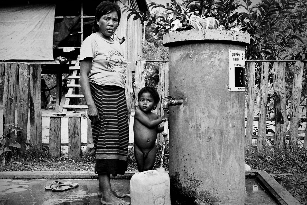Villagers using a waterpump offered by a european NGO.