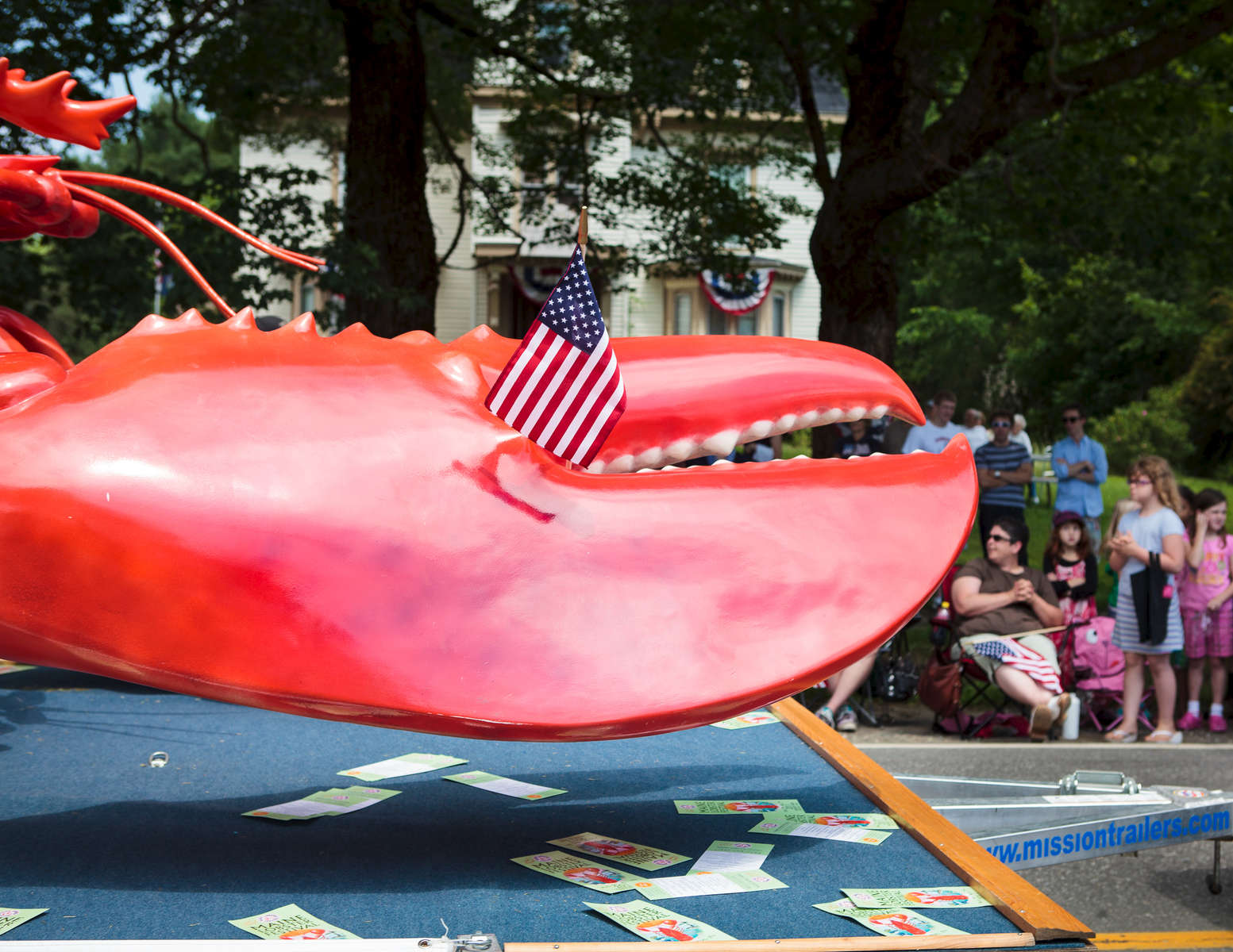 Thomaston, ME, July 4, 2011: A float in the annual Fourth of July parade in Thomaston, ME rolls down Main St.