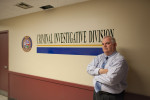 Captain Jonathan C. Webb stands in a hallway inside police headquarters in Lowell, MA. When detective Gerry Wayne (who had been handling the McCabe case) died in 2009, Webb choose detective Linda Coughlin to lead the investigation into McCabe’s murder.  