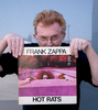 “The album is ‘Hot Rats’ by Frank Zappa.  I played it often when I was in my Art School years and it was so inspiring.  Every time I put it on, I just went to work. It’s an interesting project you’re doing because listening to it again now, just recently, it’s coming back to me why I liked it so much.It’s a jazz-rock album; I think it’s the first or second Zappa did by himself without the Mothers. It’s quirky, inspirational, and virtuoso – it’s got a great horn section on it – and Jean-Luc Ponty on violin.  Zappa takes you along a road for a certain way and then suddenly he’s off to the left or right.  It always keeps you moving.  Sometimes a track starts slow, and then goes into driving rhythms and so forth.  It keeps you on your toes.At the time, being raised in England, I wasn’t subject to a lot of jazz like Americans were and so this album was an introduction to it…. a blending of jazz and rock.  It assumed a lot of freedom, away from pop music’s three minute song and it’s over.  These tracks are as long as 16 minutes, I like that.  It’s has a sense almost like rock and roll orchestras… all kinds of subtleties moving through the rhythms.  It’s great; it just inspired me every time I put it on. I didn’t have many albums, I was kind of poor… what’s changed! - and that was one and it stayed with me.Also I loved the cover. I was madly in love with the girl* on the cover, photographed in the swimming pool with her hands coming out. I just recently found out that she was born in 1948 and died in 1972 of a heroin overdose. I only just found that out  - tragic. She was actually not much older than me. It would have been nice to have met her, even later on, now I’m in Los Angeles. The photograph was taken up in the old Errol Flynn estates apparently.  So, the big hair and everything like that, the panda eyes, the hippy era … though Frank never liked hippies - I don’t know why he liked the cover – he didn’t take the photograph.  I guess everything about that album is terrific.I love it.”Colin Fraser Gray: Culver City CA, 30th March 2015Frank Zappa: Hot Rats released 1969.Colin Fraser Gray* Miss Christine of The GTOs