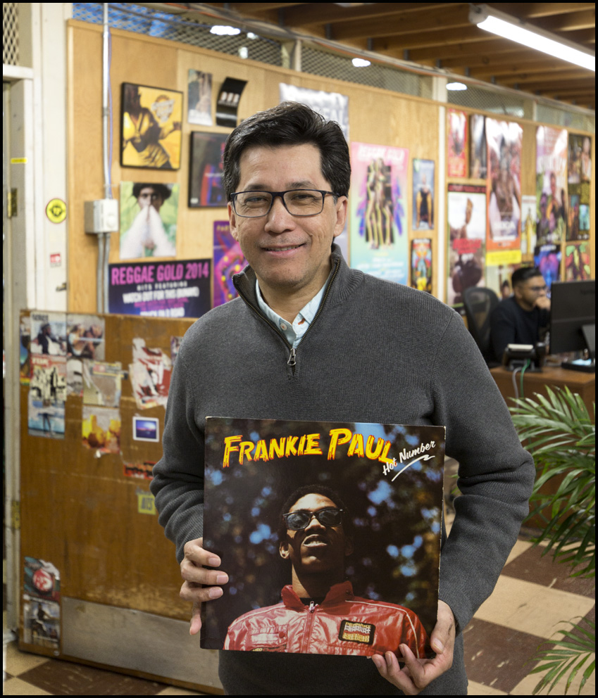 Randy Chin: President VP RecordsFrankie Paul: “Hot Number” - released 1992{quote}The reason this particular album is special to me is that I actually happen to be the photographer on this album. I took both the cover shot and also the shot on the back of the album.The album is Frankie Paul Hot Number. And the big song off of the album was {quote}Kushumpeng.{quote} And I guess my focus really is the photography, but I remember the time that I took the picture - this was actually at the VP retail store on Jamaica Avenue and I took the picture in the parking lot because I know Chris, my brother, wanted to do this album and he needed some pictures of Frankie Paul. I happened to be there with my Canon camera.. I don't remember, an F1 or whatever the name of the camera was .. but I happened to be there and I just, you know, got a hold of Frankie, and we just went into the parking lot and I took a couple of shots, then lo and behold they ended up on the cover - incredible!{quote}Randy Chin: VP Records, Jamaica, Queens, NY, 6th February 2019Frankie Paul: “Hot Number” - released 1962VP Records
