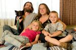 From left to right: J.D., Mary Delp, her two children Elijah Delp, 6, and Krystallynn Delp, 7, and one of their dogs, Tinkerbell, are photographed at Mary’s Place the Guest Rooms in South Lake Union in Seattle, WA on June 23, 2016. The Guest Rooms provide transitional housing for families including those with pets. Delp says she wouldn't have come here if they didn't allow Tinkerbell and the family would be sleeping in the sleeping in their van. (photo © Karen Ducey Photography)