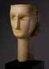 SOUTHERN ARABIA (100 B.C. – 100 A.D.)Calcite-AlabasterH: 28.30 cm (11.14 inches)A magnificent funerary head of a woman from Qataban, depicted with wonderfully stylized features. The nose is slender, and the small lips are gently smiling. The ears are positioned high on the head and the neck is long and elegant, possibly as a sign of the woman’s beauty. The high cheekbones have been subtly carved. The large, deeply recessed eyes and thin eyebrows would have once been inlaid. The top and back of the head are flat for insertion into a funerary niche or stela and the front has been polished to enhance the quality of the alabaster. The coiffure would have once been completed with plaster, which would have helped secure the head in place. Such heads are often referred to as being U-shaped. The people of South Arabia developed a unique visual culture which, thanks to its ingenious use of geometric and stylized forms, appears resolutely modern to our contemporary eyes. South Arabian artists notably excelled in carving beautiful funerary portraits in alabaster. The present head is a particularly delightful example of sculpture from the Classical period. Its style is characteristic of the funerary portraits found in Hayd ibn Aqil, the necropolis of Qataban’s capital Timna.GBP 600,000