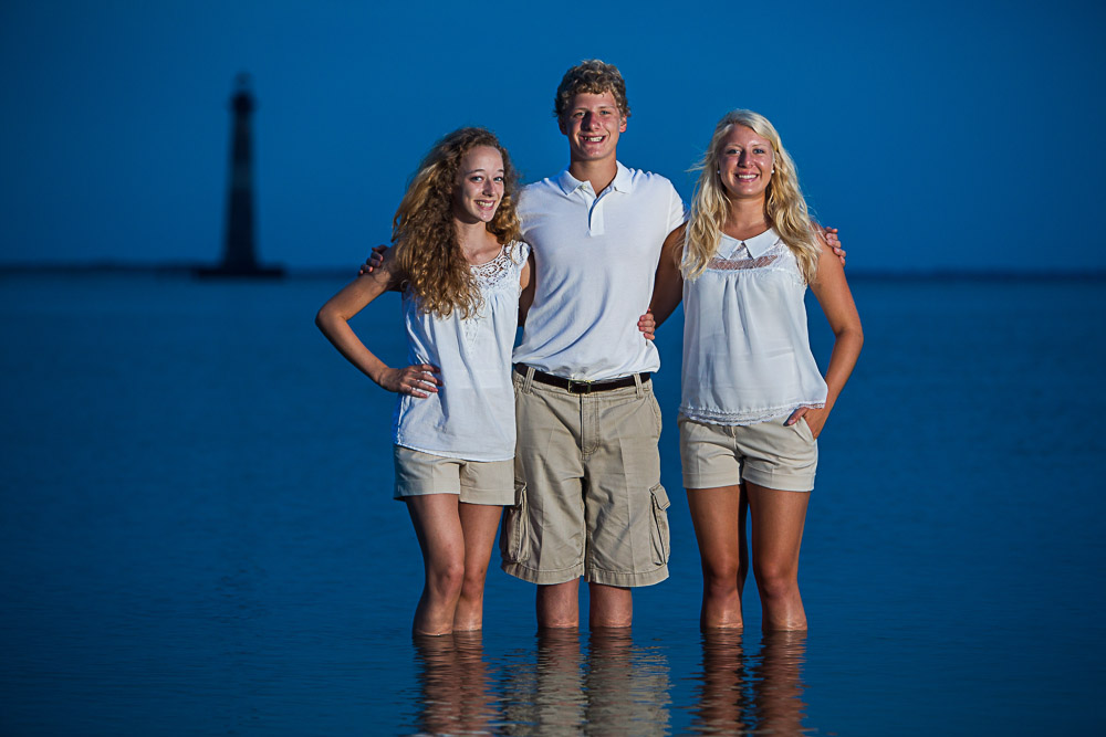 Folly Beach photo session.  Beach photography taken with Morris Island Lighthouse in the background.