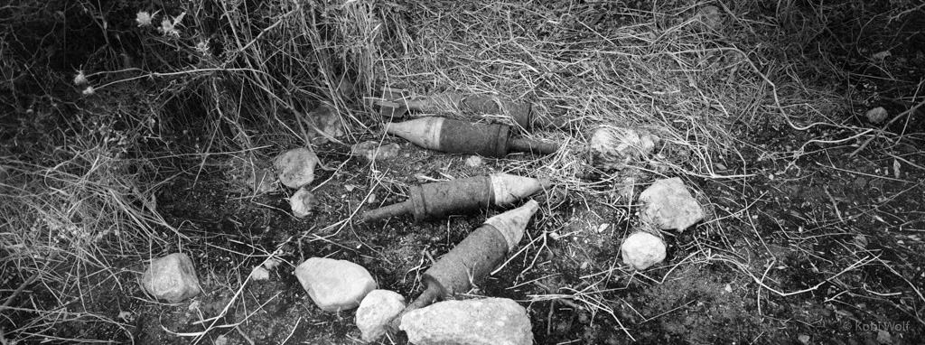 Unexploded shells on a farmland. In IDF’s training areas, which are partly used by Palestinian farmers as plantations, the army leaves behind thousands of unexploded shells and ammunition. Children and adults often get killed while working their land.