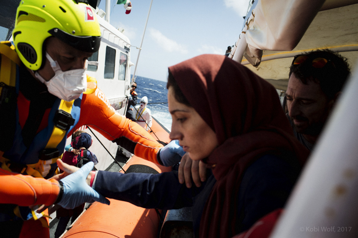 A Syrian refugee brought into the Italian coast guard boat on her way to lampedusa island in Italy. 