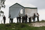 Israeli activists carry a tent in the abandoned Jewish settlement of Homesh, in the northern West Bank, March 27, 2007. Hundreds of Jewish activists on Monday poured into a West Bank settlement evacuated by Israel in 2005 and said they planned to re-establish a Jewish presence there