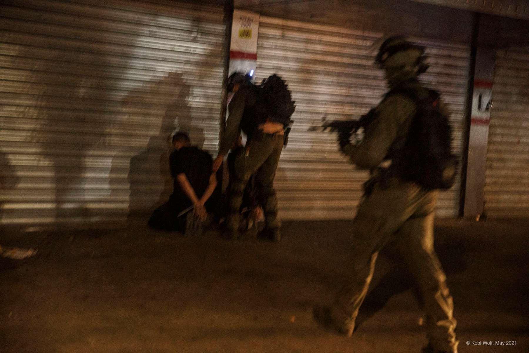 Israel police forces arrest Israel Arab from Lod during a riot in the Lod,central Israel, Thursday, May 13, 2021 