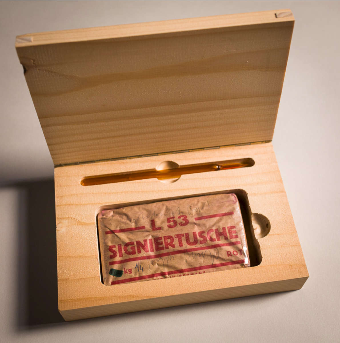 Joseph BEUYS (1921 - 1986)Economic Value Signature Ink (Wirtschaftswert Signiertusche)Block of signature ink in wrapper, with handwritten addition, and glass pen; in wooden box4 1/2 x 8 1/4 x 2 in (14 x 21 x 5 cm)Signed in pencil {quote}Joseph Beuys{quote} and inscribed {quote}1 Wirtschaftswert{quote} on the ink wrapper; numbered 1/4 in blue ink; weight crossed-out in markerEdition 50 – The present work is number 1 of 4 AP's, aside from the edition of 50Publisher: Edition Staeck, HeidelbergPlease click HERE for full fact sheet