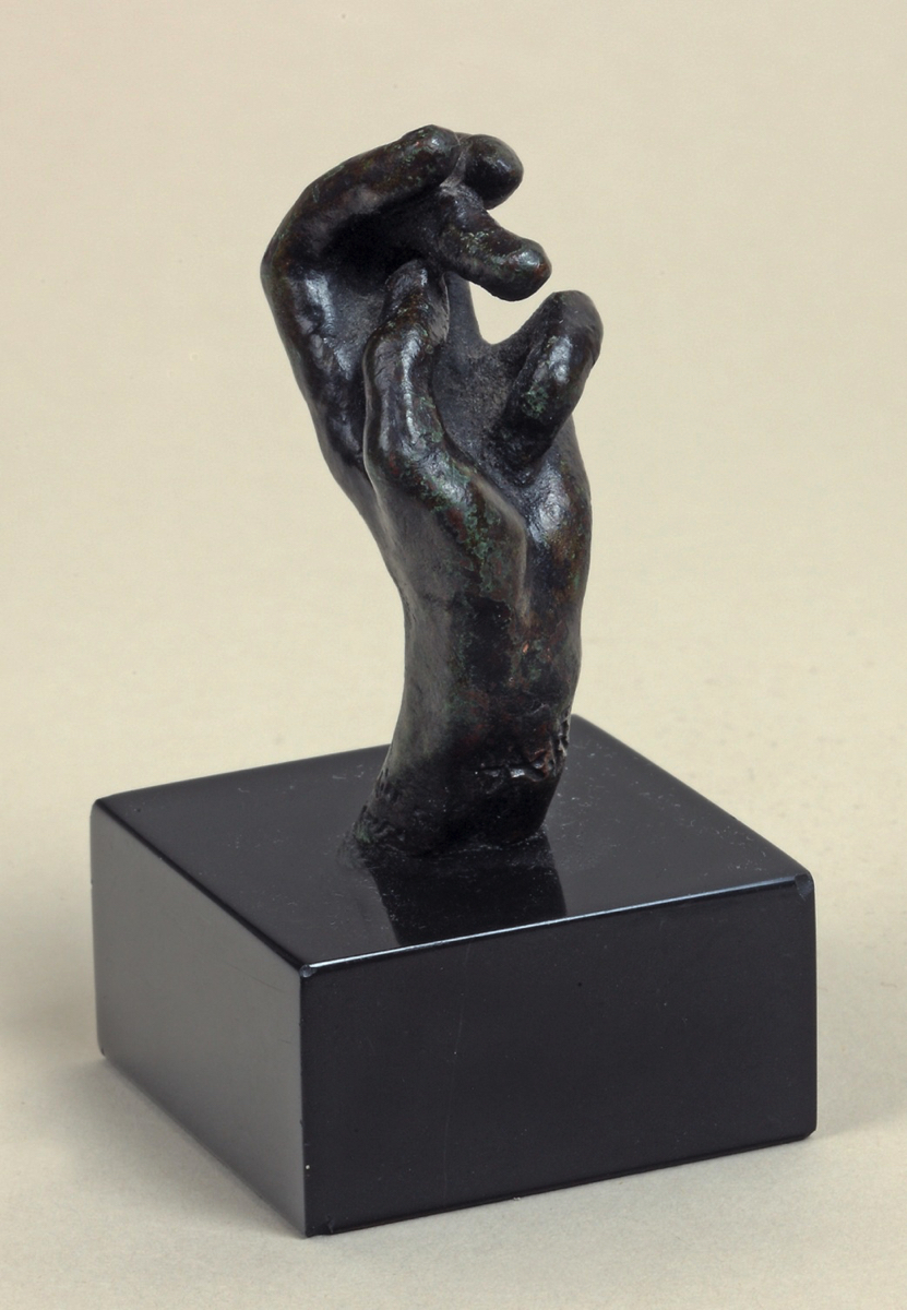 Auguste RODIN (1840-1917)Bronze with black and green patina – sand-cast processHeight 5,4 cmInscribed ‘A. Rodin’ on the inside of the wrist andWith the foundry mark ‘G. Rudier / Fond. Paris’ on the outside of the wrist  Conceived between 1890-1908, cast in 1966