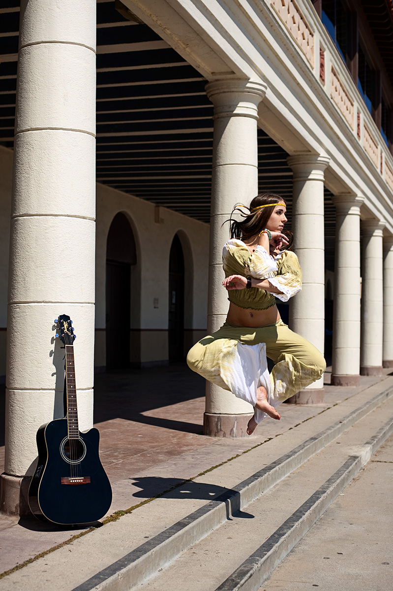 Kayla Raw, 21, from Reno, Nev., is dancing at East Beach with her guitar in Santa Barbara, Calif., on Monday, September 12, 2011. {quote}The photoshoot was fun, creative, and I enjoyed dancing,{quote} Raw said.