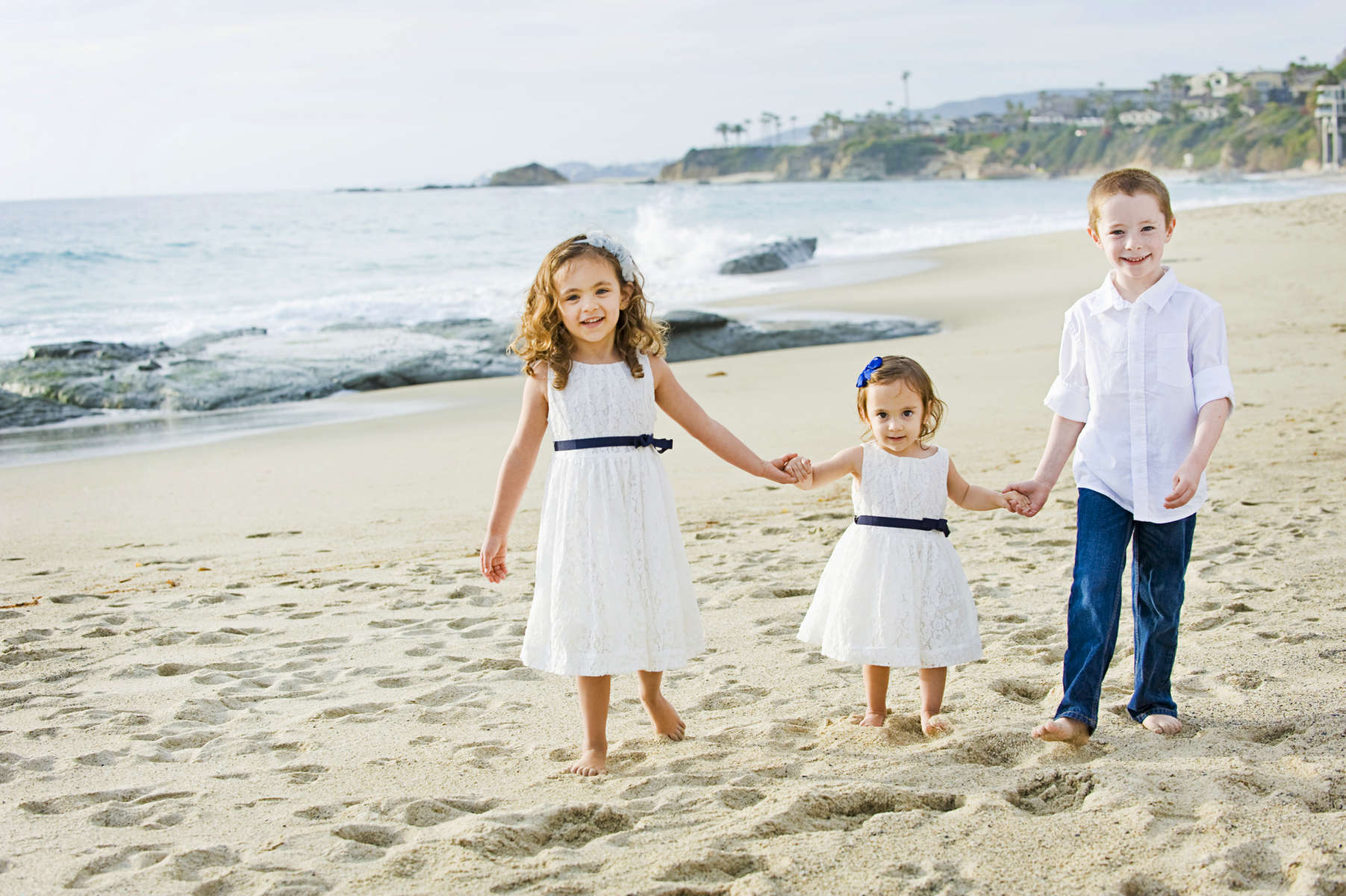 Drake Nations, 6, and his sisters, Lilah Nations, 4, and Audrey Nations, 1, from Laguna Hills, CA, loved holding hands along the sand at Aliso Beach in Laguna Beach, Calif., on Thursday, March 3, 2016.