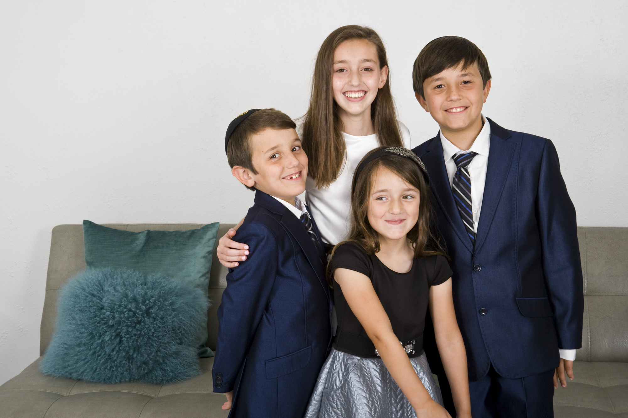 In celebration of Isabella Sztuden's, 11, upcoming Bat Mitzvah, the Sztuden's and their extended family from out of town have family portraits taken at the childhood home of Isabella's mother, Leslee, on Friday, June 24, 2016 in Sherman Oaks, Calif.  Isabella Sztuden is surrounded by her siblings, Aiden Sztuden, 10, Benjamin Sztuden, 7, and Abigail Sztuden, 5. 