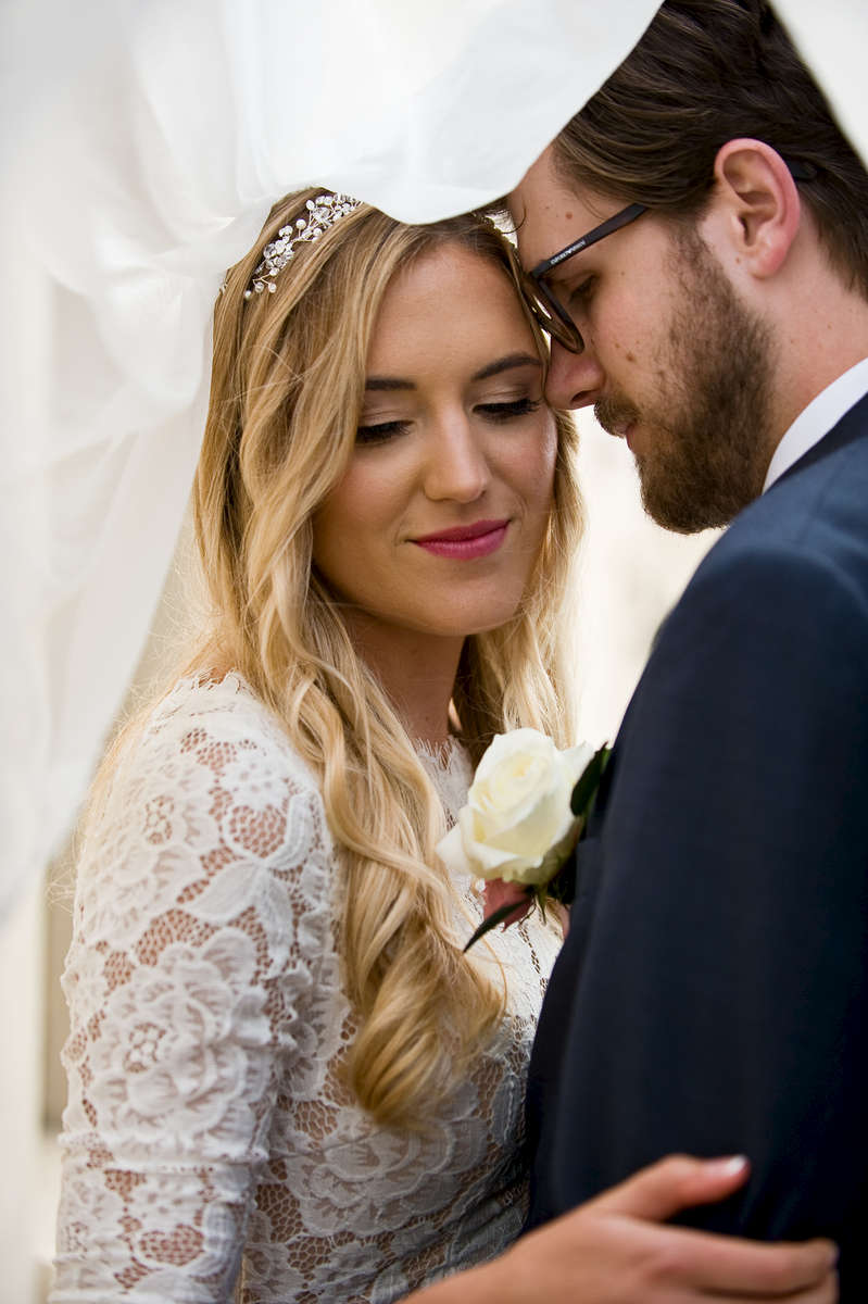 Bride, Emily Knudson, 22, marries her high school sweetheart, Jake Wade, after six wonderful years at San Clemente Presbyterian Church followed by a reception in his grandparents backyard in San Clemente, Calif., on Saturday, March 31, 2018.  The entire wedding day was easy going, full of love, smooth, tear-filled, and ended with the couple flying to Kauai for their honeymoon the next day to begin their marriage as newlyweds. (Photo by: Meagan Reidinger © 2018)