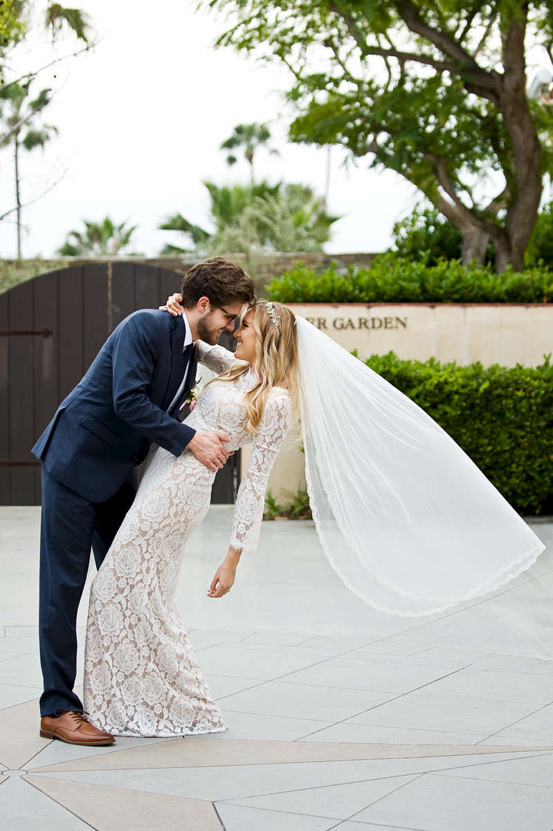 Bride, Emily Knudson, 22, marries her high school sweetheart, Jake Wade, after six wonderful years at San Clemente Presbyterian Church followed by a reception in his grandparents backyard in San Clemente, Calif., on Saturday, March 31, 2018.  The entire wedding day was easy going, full of love, smooth, tear-filled, and ended with the couple flying to Kauai for their honeymoon the next day to begin their marriage as newlyweds. (Photo by: Meagan Reidinger © 2018)