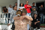 Denise Batista is comforted by her friend, Claribel Cruz, surrounded by family members and friends who gathered at her home in the Heights a day after her son, Juan Batista, 26, was shot to death in what authorities believe was a retaliatory killing in response to the shooting of a Latin Kings member earlier in the year. Denise Batista called her son {quote}a happy person{quote} who was trying to put his life back together after spending time in jail. (Reena Rose Sibayan | The Jersey Journal)