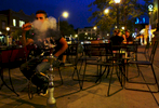 Ali Abdulrazzak blows out a puff of smoke at Ranoush Nights, a new venue in the Loop.  
