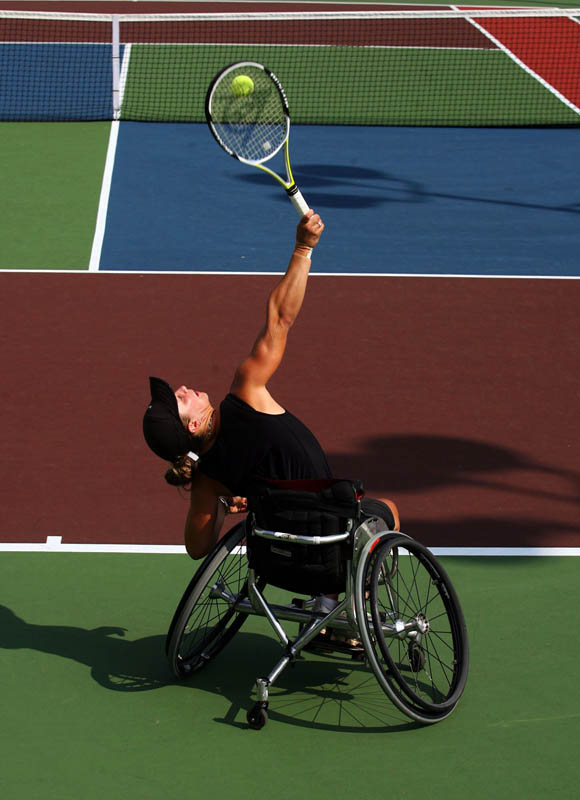 Lucy Shuker, of Fleet England, serves the ball to opponent Jordanne Whiley (not pictured), of Halesowen England, during the Women's Open Consolation Final at the US Open USTA Wheelchair Championship at Dwight Davis Tennis Center in Forest Park. Shuker won 6-1, 7-5.