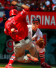 Angels' Erick Aybar slides into second base as he is hit by a throw from Albert Pujols to Brendan Ryan in the fifth inning as the St. Louis Cardinals take on the Los Angeles Angels at Busch Stadium. Aybar was safe at second on the hit by Angels' Howie Kendrick.