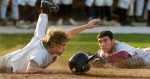 Schaumburg catcher Dominick D'Agata and Hersey' s Josh Harwell try to beat each other to homeplate Monday at Hersey High School.  Harwell was safe.