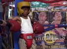 Cat' Daddy Knight stares down his opponent in the opposite side of  the ring.  The seven-year-old has been boxing for three months.