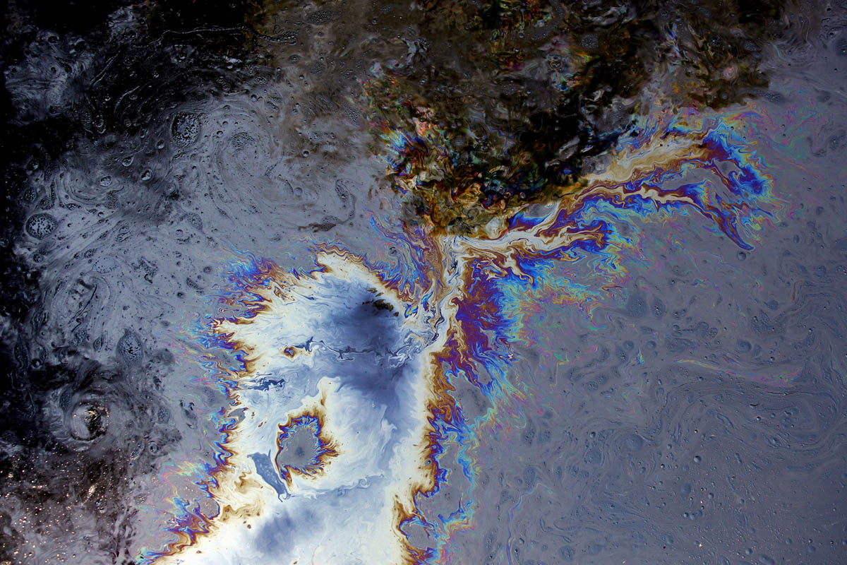 Crude oil swirls in the Kalamazoo River near 15 Mile Road in Marshall. The U.S. Environmental Protection Agency has estimated since the first days of the spill, which was one of the worst in Midwest history, that the volume of oil released into Talmadge Creek and then into the Kalamazoo River was more than 1 million gallons.