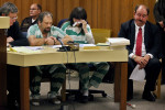 Defense attorney Victor Bland, right, reacts as Anthony Springer, reads a statement to the court before he and his wife, Marsha Springer, center, receive their sentence after being convicted of torture and child abuse for the death of their daughter, Calista Springer. Calista died in a fire while she was chained to her bed. 