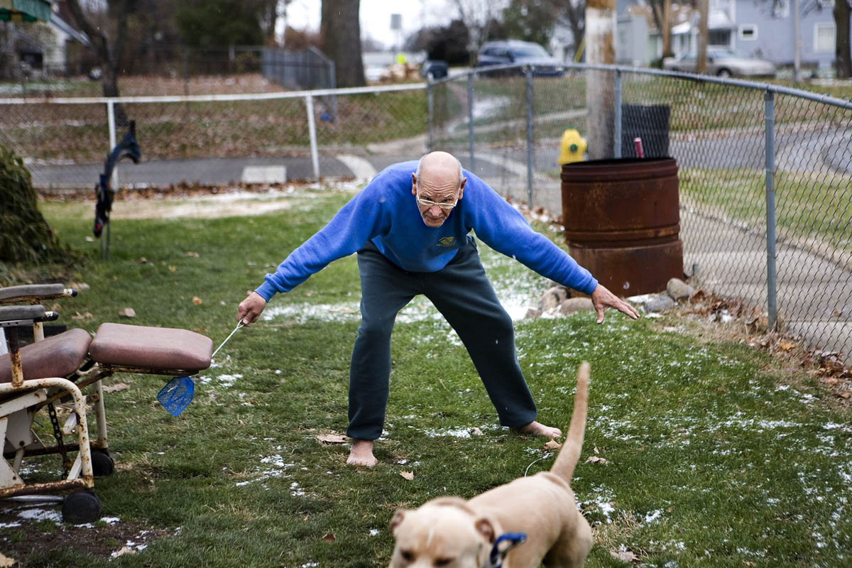 County Commissioner Frank Thompson chases his dog around his yard attempting to put a leash around him.  Mike, a 100-pound beast of a pit bull-Labrador mix, once jumped through the living room window at the sight of the neighbor's cat. Thompson, 82, was elected in November to his fourth consecutive term on the Kalamazoo County Board of Commissioners. Thompson is full of eccentricities that make him stand out on the county board. {quote}He endeared himself to us,{quote} says Vice Chairwoman Deb Buchholtz-Hiemstra. {quote}He's out in his community all the time, talking to his neighbors. You can just tell there's a lot of emotion in what he says and what he brings to the board.{quote}  