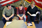 David Wrench, center, takes a deep breath at the Portage Recruitment Center as Staff Sgt. Shoji Harris goes over final paperwork and preparations for David's departure into U.S. Marine Corps boot camp in San Diego. David is flanked by his father, Tom Wrench, and mother, Jonna Jameson. The 18-year-old graduated early from Plainwell High School in order to leave for boot camp.