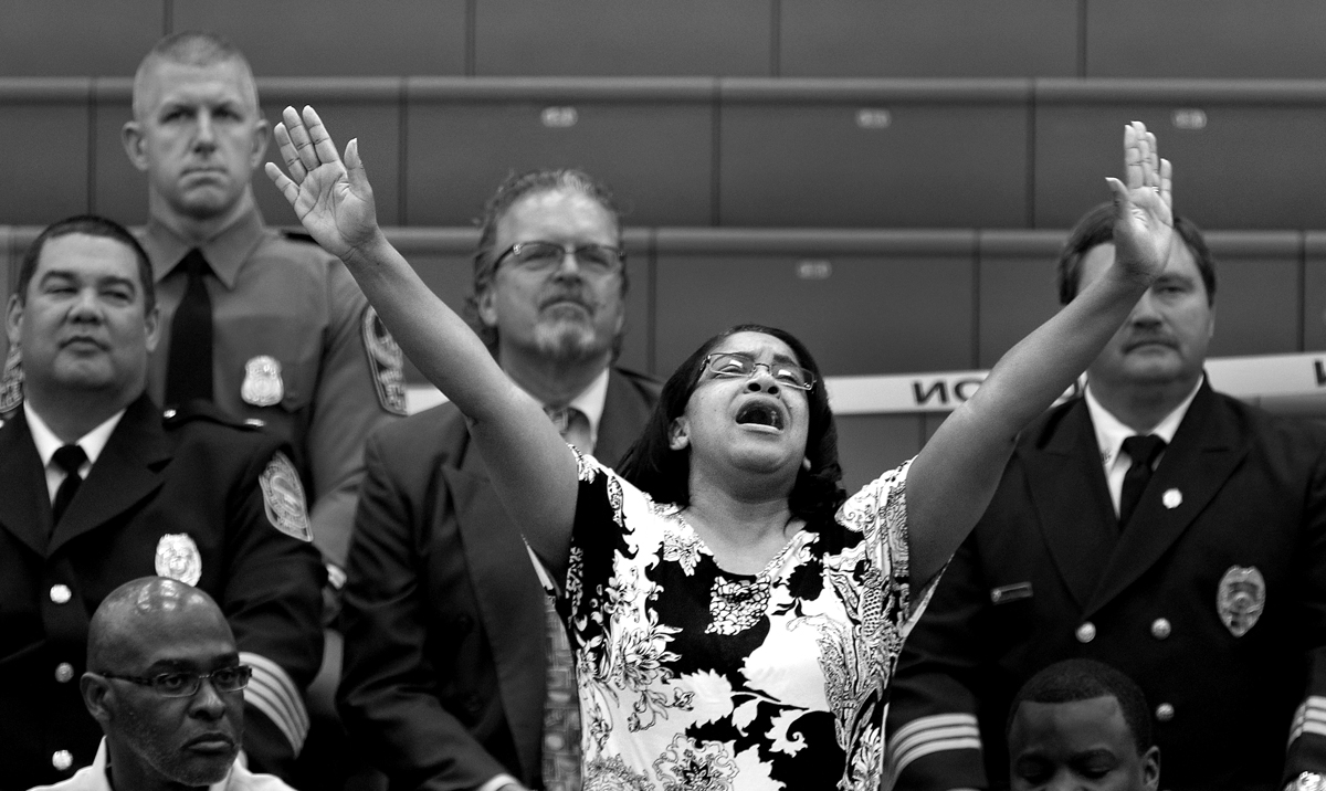 Dionne Williams, the mother of Jauwan Holmes, emotionally sings along to {quote}I'll Fly Away{quote} with the Virginia State University Gospel Choir as they dedicate the song to him. A memorial service was held at VSU's Daniel Gymnasium for Holmes and Marvell Edmondson after both drowned in the Appomattox River during what authorities have called a hazing incident.