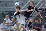York's Max Poelker heads the ball away from Tabb's Andrew Lenfant, right, during Friday's Conference 27 final at Bailey Field on May 27, 2016. 