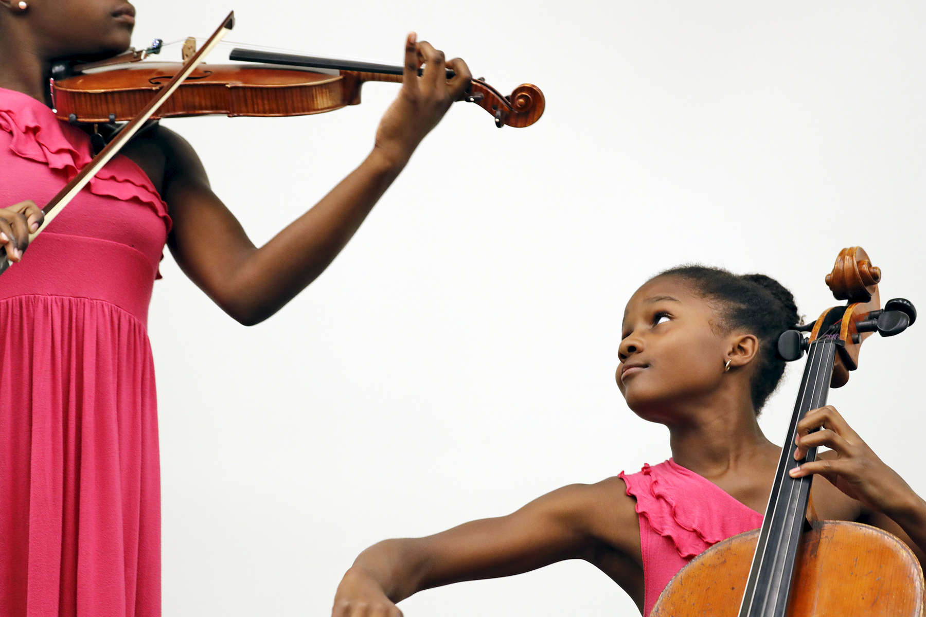 Violinist Kearston Gonzalez, left, and cellist Kendall Gonzalez perform to an audience gathered at the Tabb Library in York County Wednesday afternoon August 9, 2017. The sisters have performed at WNBA and NBA games in Washington, D.C., Charlotte and Houston and both have performed as a soloists with orchestras and won musical competitions. 