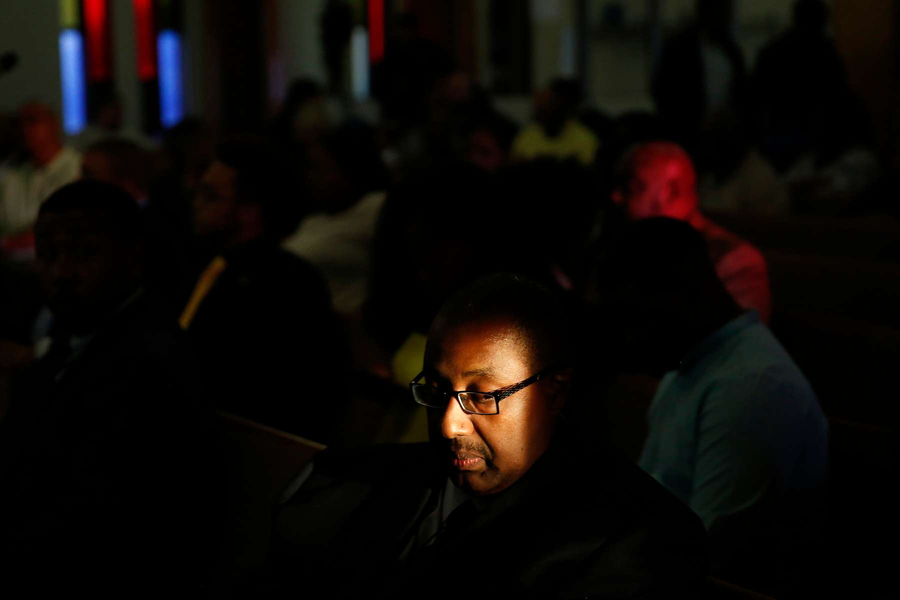 Pastor Andre Jefferson sits in reflection during the start of an event to commemorate the 50th anniversary of MLK's death at Bethel AME Church Wednesday evening April 4, 2018. Over a hundred people attended the event which was hosted by the Hampton Chapter of the NAACP and Hampton University. 