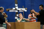 John Vincent Grogan III, center, looks to the heavens after being baptized by St. Joseph County Jail chaplain Jake Schwartz, left, and Three Rivers' Riverside Church assistant pastor Jerry Solis, right, during a full immersion baptism of inmates at the St. Joseph County Jail in Centreville Thursday morning. The baptism was through the church's Christ Center Celebrate Recovery program.   