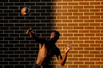 Bruton's Mikal Whack throws the ball during a water break of Thursday evening's football practice July 25, 2019. Bruton, a school of 600, always struggled with small football participation numbers and in a 2018 lost two of its best linemen to injury.  That left the Panthers with 15 players, half of them with no varsity experience. The team cut their schedule in half and were outscored 262-14 during their winless season. In 2019 the team will return to playing a full 10-game season.  