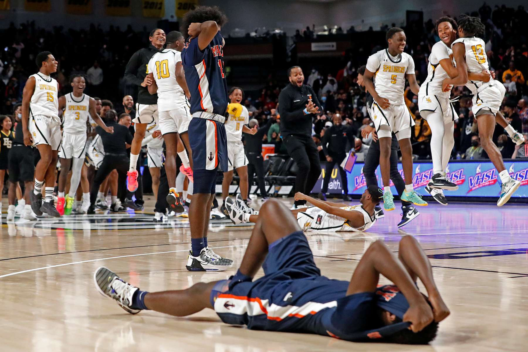 Maury's Casey Jones, left, and Adrean Newton react after losing to Highland Springs during Friday's Class 5 state championship boys basketball game at Virginia Commonwealth University's Siegel Center March 11, 2022. 
