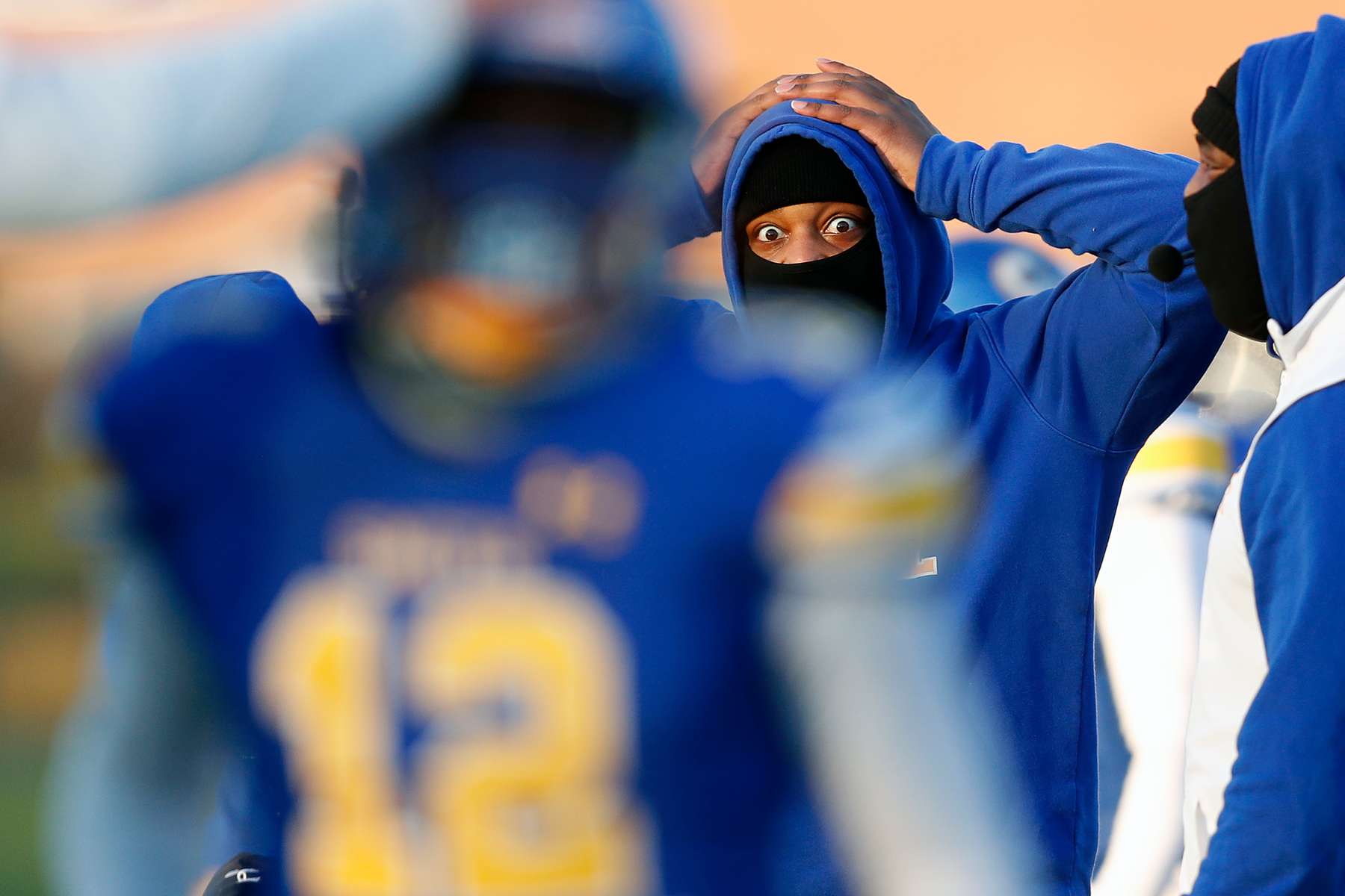 An Oscar Smith coach reacts after a near interception by Bryan Stukes during Friday evening's football game against Indian River at Oscar Smith High School April 2, 2021. 