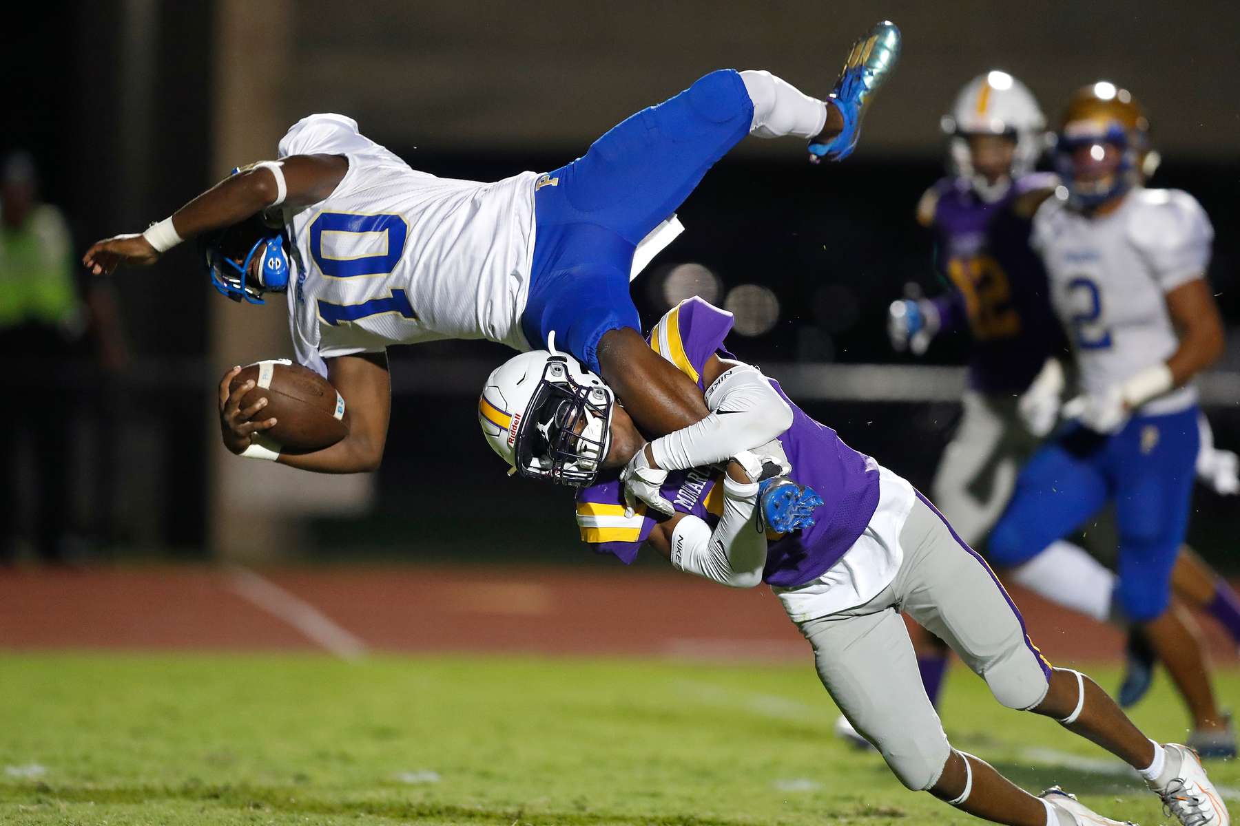Phoebus' Mark Wagner is tackled by Menchville's Kendrick Fultz during Thursday evening's game at Todd Stadium September 2, 2021. 