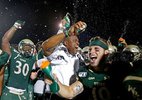 William and Mary head football coach Mike London, center, celebrates with his players after defeating Lafayette 30-17 during Saturday’s football game at Zable Stadium August 31, 2019. 