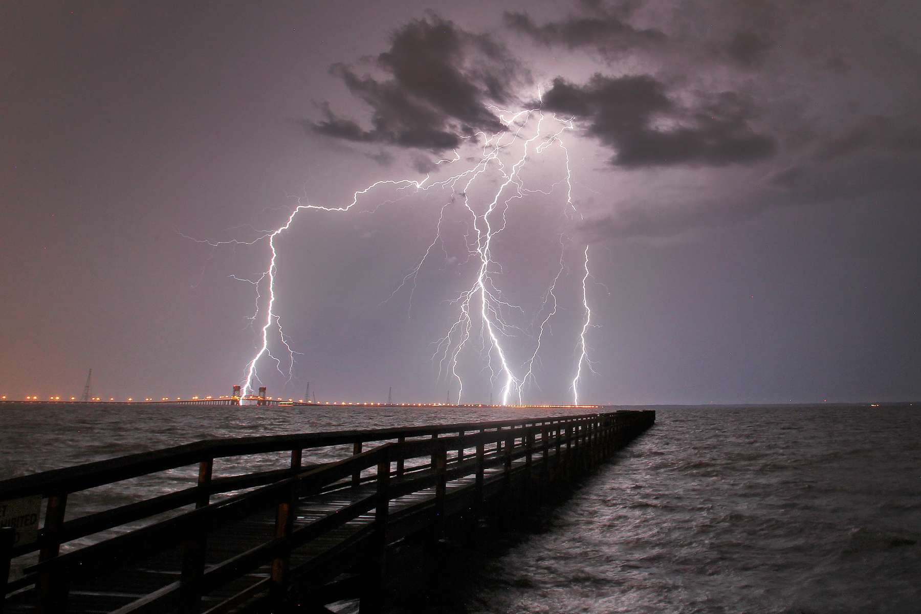 Lightning flashes over the James River as severe thunderstorms move through Hampton Roads Tuesday evening. 