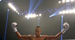 Raymond Daniels celebrates after defeating Jonatan Oliveira during Friday's tournament presented by Glory Sports International at the Hampton Coliseum. 