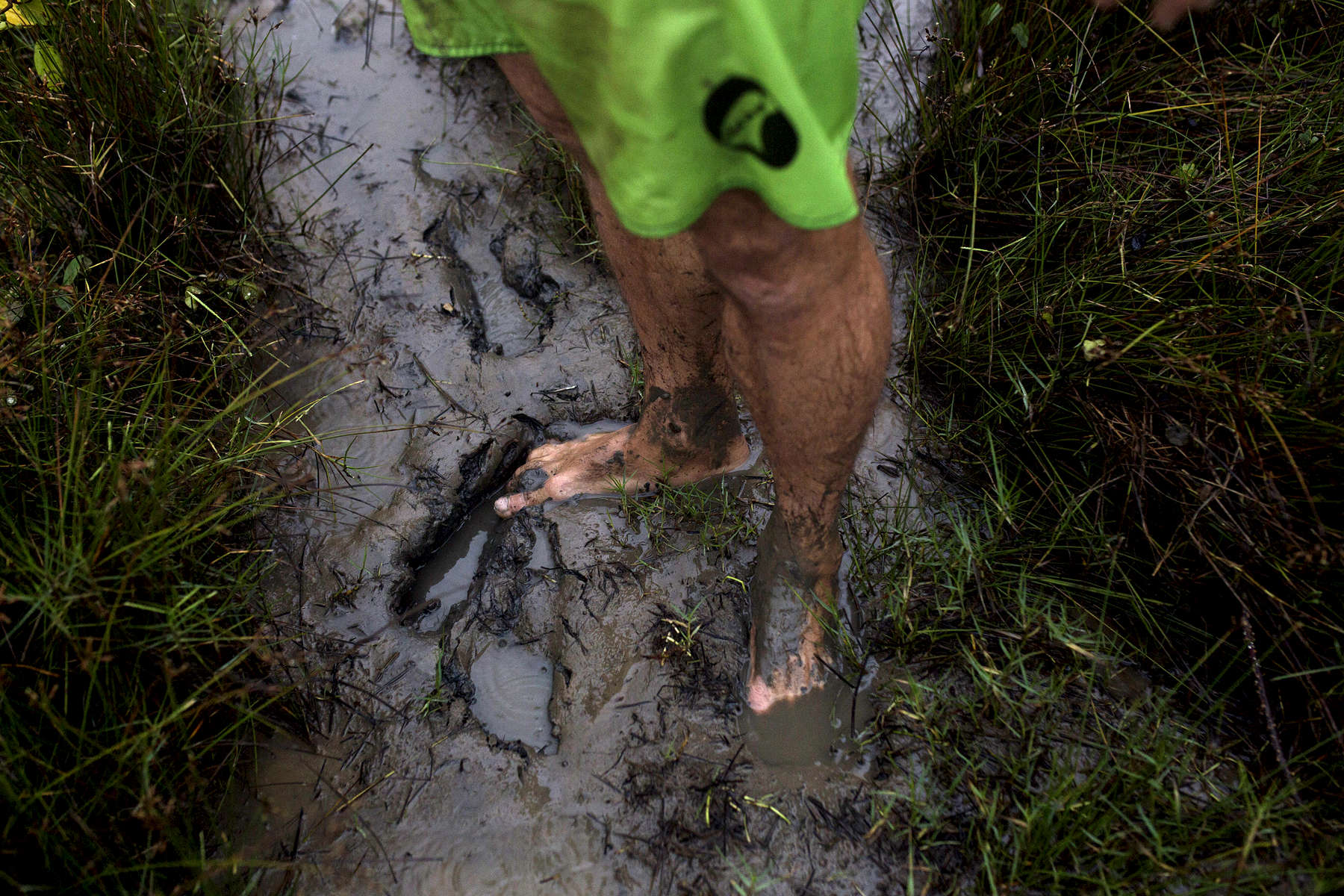 Ivan Moreira's muddy feet on the shore of the Amazon River.