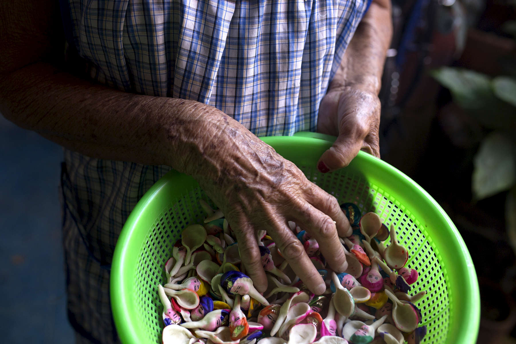 Guadalupe Sánchez holds a bowl of caritas in her family home in Miahuatlán.