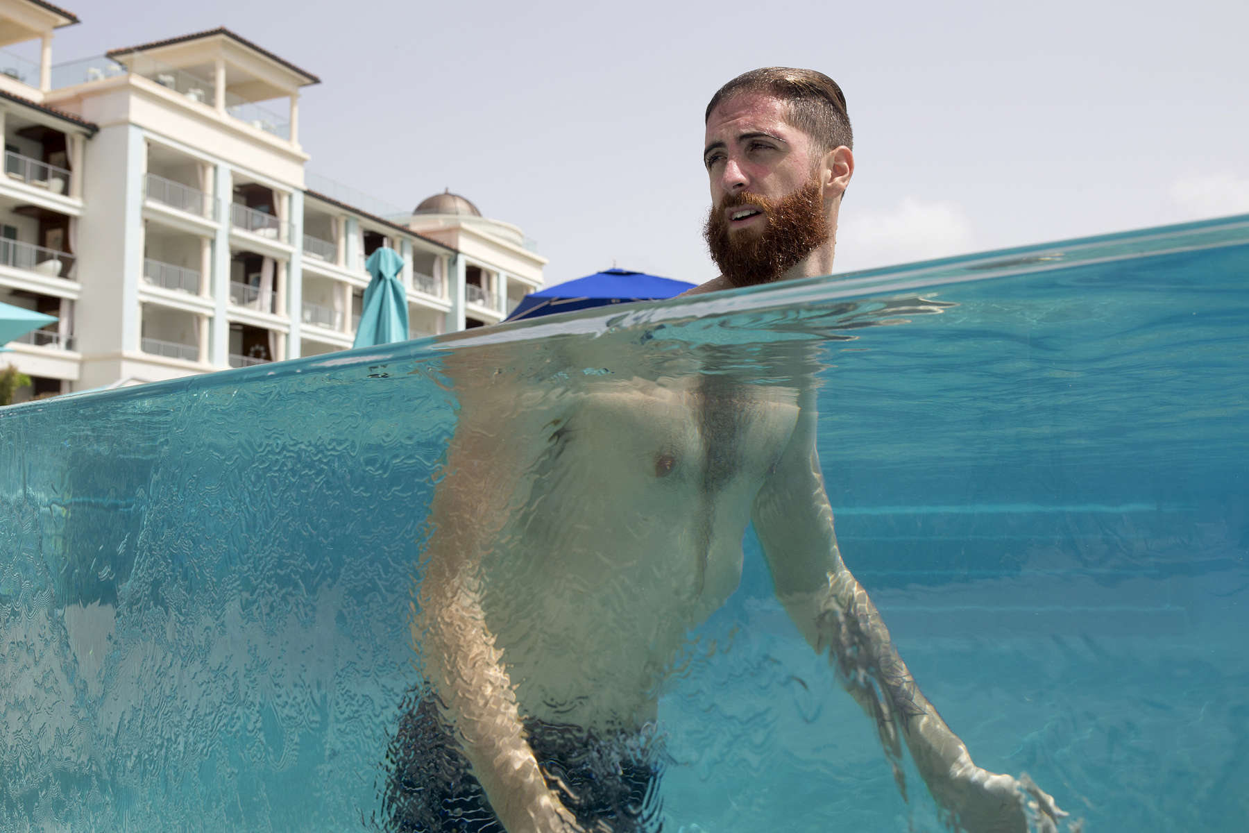 Joel Balsam swims in a pool at Sandals Resort in Barbados.